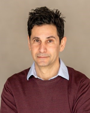 Fara Dabhoiwala wearing a red-brown sweater